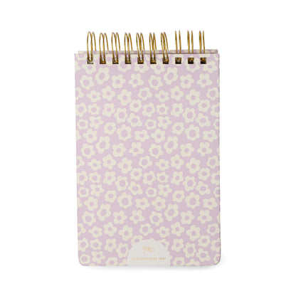 The Chunky Large Notepad - Lilac Groovy Floral is a small, chunky pocket notepad featuring a lilac groovy floral cover design. This hard cover notepad includes gold-colored wire binding at the top, rounded corners, and contains 192 sheets for ample note-taking.