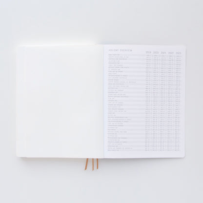 The Standard Issue Project Notebook No.4 - Black features a flexible cover, lay-flat binding, and a holiday overview table for 2019–2023 with dates and holidays clearly listed on the right page.